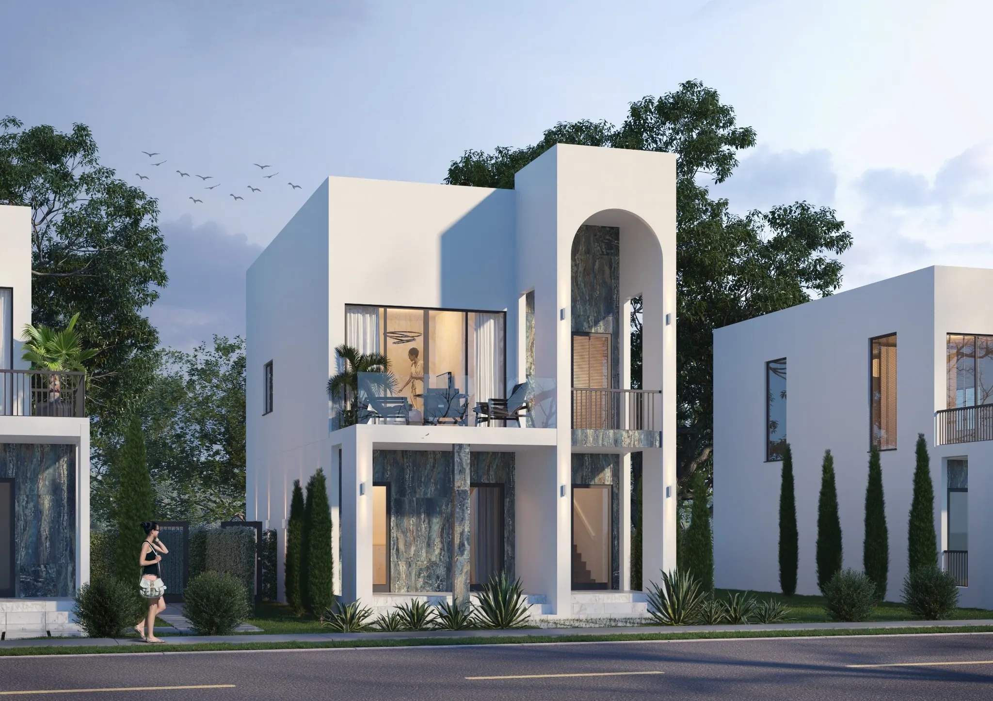 White villa with an arched facade and an upper terrace in Pensacola.