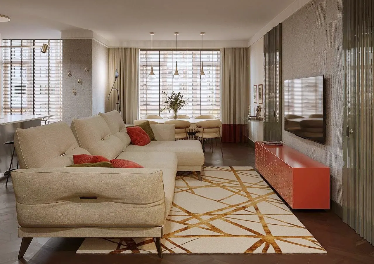 Living room with a cream sofa, red cabinet and geometric rug