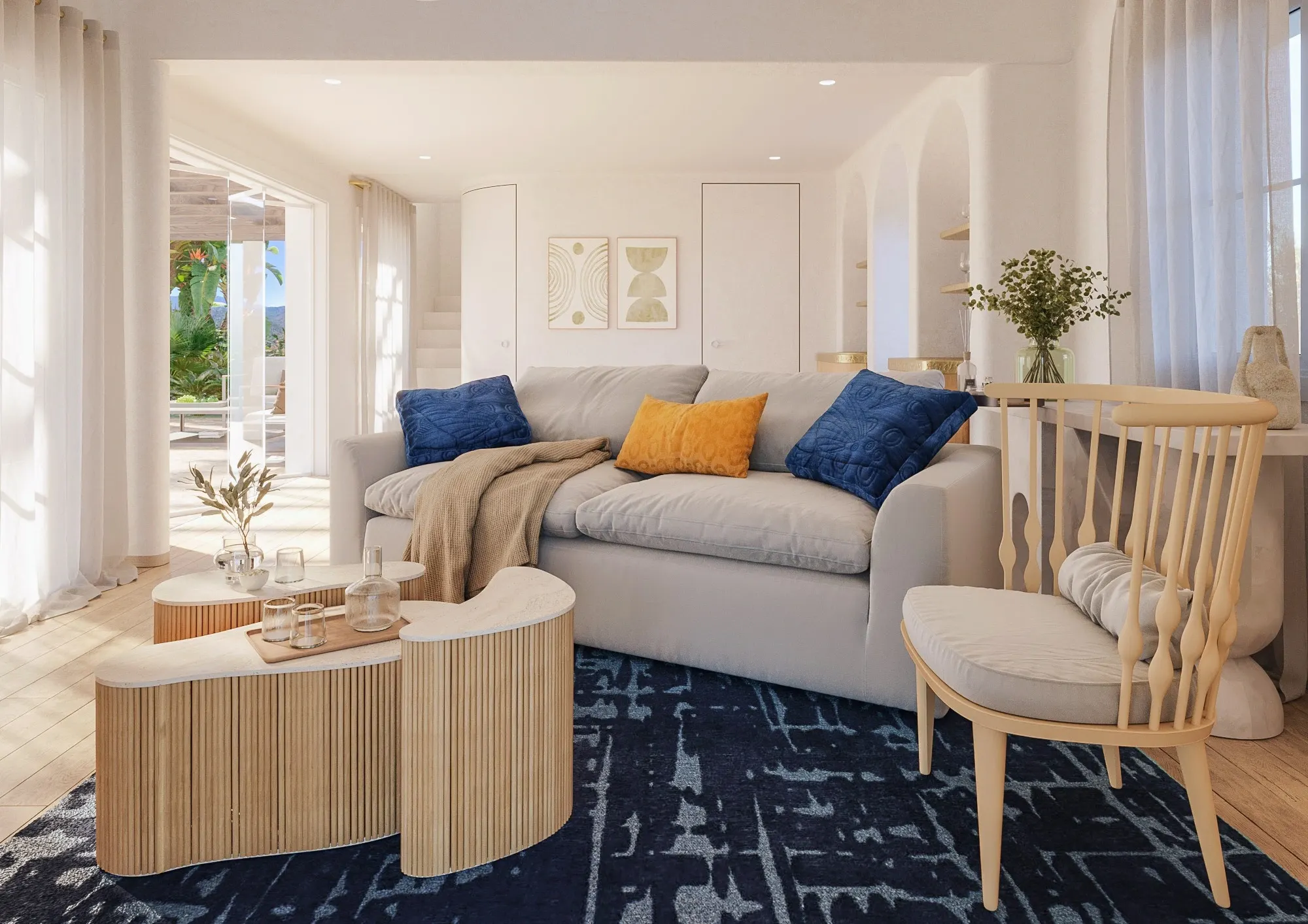 Living room textures: pale sofa, blue cushions and a patterned blue rug.